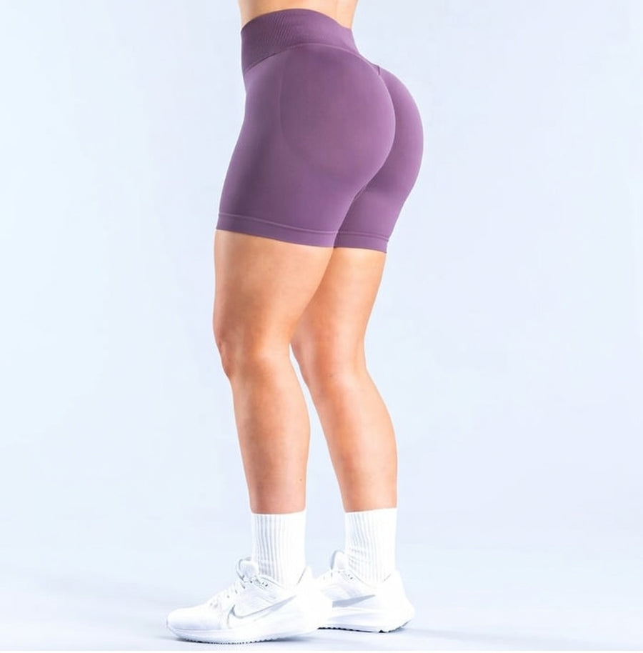 Model wearing Empower Olive Shorts Model wearing Empower Blossom Shorts