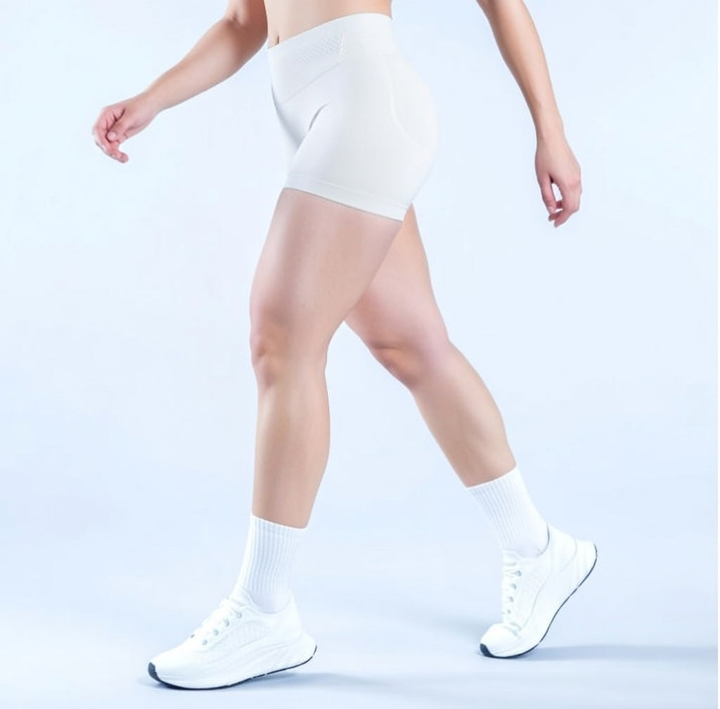 Model wearing Empower Olive Shorts Model wearing Empower Blossom Shorts