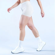 Model wearing Empower Olive Shorts Model wearing Empower Blossom Shorts