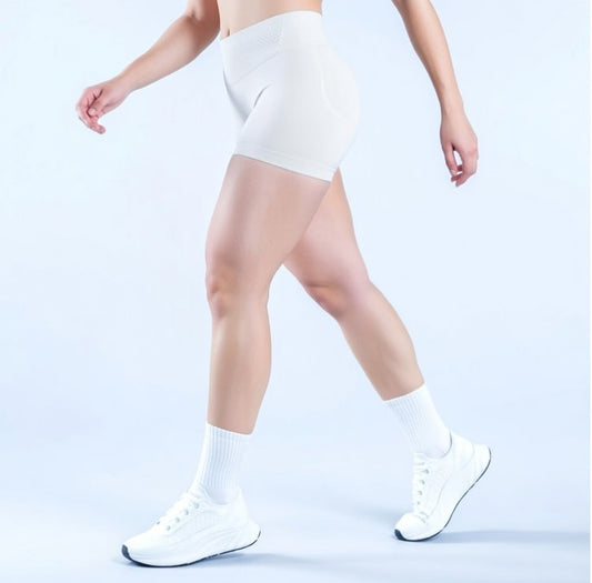 Model wearing Empower Olive Shorts Model wearing Empower Blossom Shorts