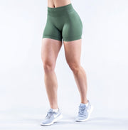 Model wearing Empower Olive Shorts Model wearing Empower Blossom Shorts