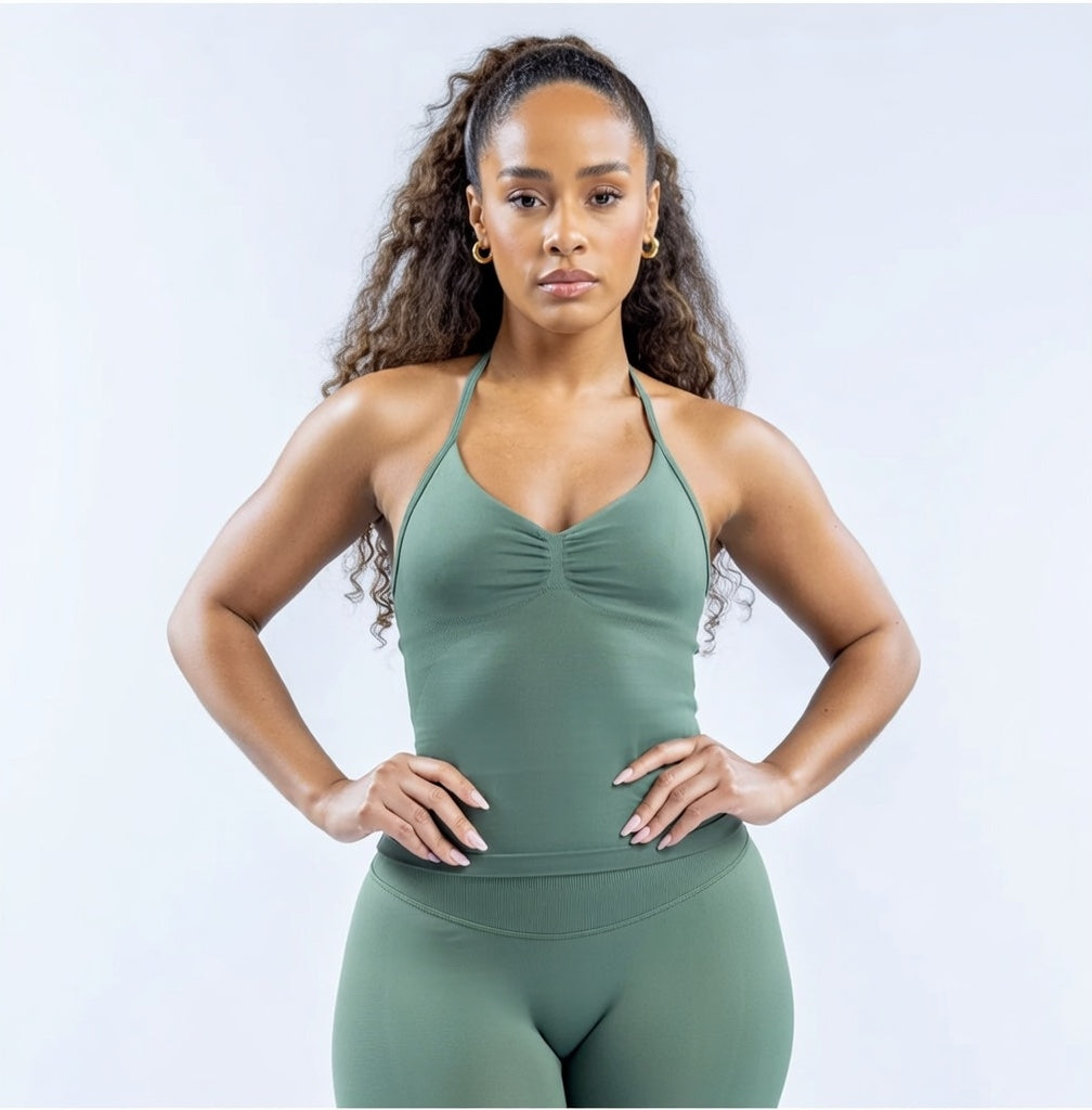 Model wearing Empower Olive Fitted Tank Top Model showcasing the Empower Grape Thistle Fitted Tank Top in a stylish pose. Model wearing Empower Scarlet Fitted TankTop Model wearing Empower Blossom Fitted Tank Top