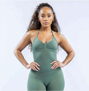 Model wearing Empower Olive Fitted Tank Top Model showcasing the Empower Grape Thistle Fitted Tank Top in a stylish pose. Model wearing Empower Scarlet Fitted TankTop Model wearing Empower Blossom Fitted Tank Top