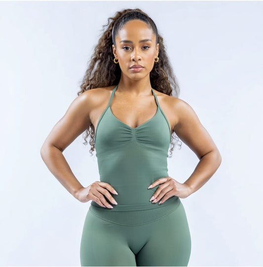 Model wearing Empower Olive Fitted Tank Top Model showcasing the Empower Grape Thistle Fitted Tank Top in a stylish pose. Model wearing Empower Scarlet Fitted TankTop Model wearing Empower Blossom Fitted Tank Top