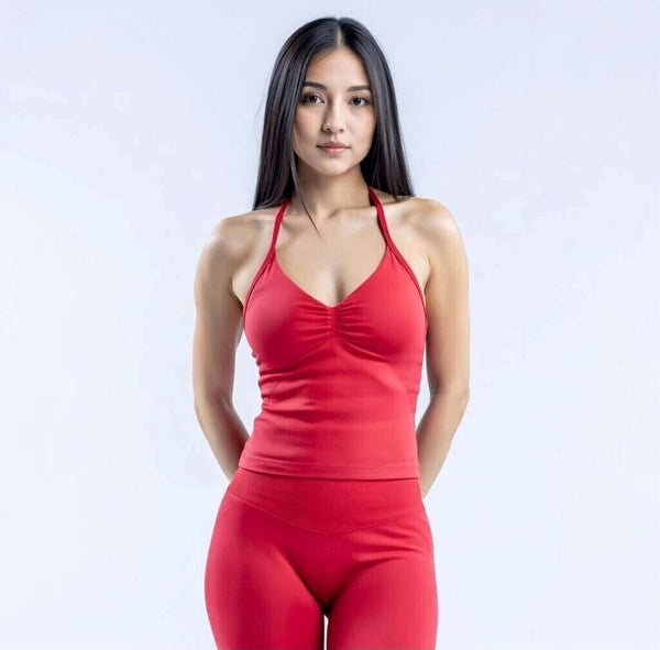 Model wearing Empower Olive Fitted Tank Top Model showcasing the Empower Grape Thistle Fitted Tank Top in a stylish pose. Model wearing Empower Scarlet Fitted TankTop Model wearing Empower Blossom Fitted Tank Top